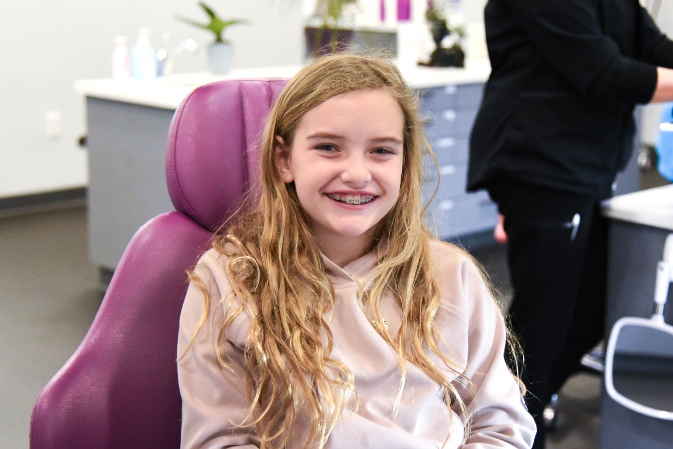 Young girl smiling with braces during her appointment at Marina Milstein Orthodontics in Granite Bay CA